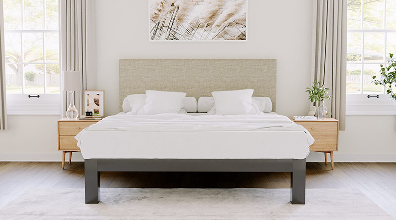 Charcoal King Platform Bed with an oatmeal headboard in a neutral upscale master bedroom seen directly from the foot of the bed.