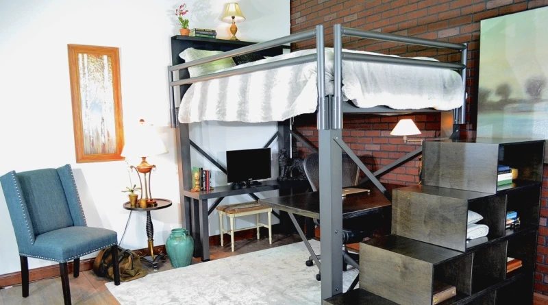 A charcoal Adult Loft Bed with a staircase accessory seen from a corner angle