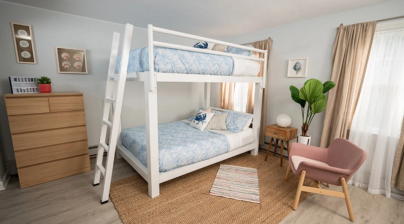 A white Adult Bunk Bed in a light and airy vacation rental on the beach.
