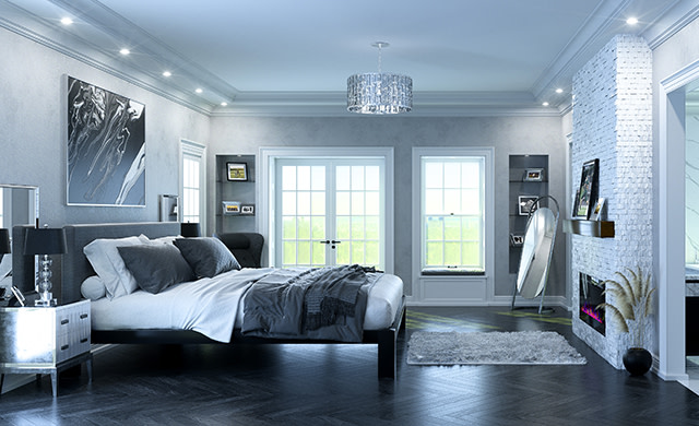 A black metal Alaskan King size platform bed with a gray headboard and various shades of gray bedding in a high end luxury master suite seen from a wide angle at the right side of the bed.