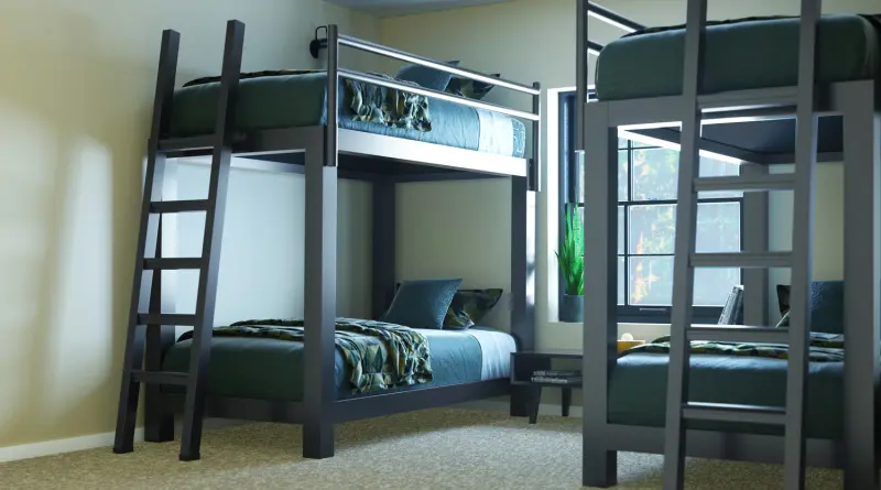 Two Charcoal Adult Bunk Beds in a simple dorm bedroom. Seen from the lower left-hand corner of the bed on the left side of the frame, with the other partially in frame on the right side of the image.