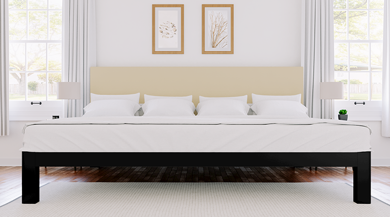 Black Alaskan King size metal Platform Bed with a tan Dune headboard seen in a nice room from directly at the foot of the bed.