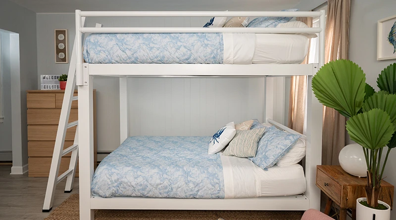 A white Queen Over Queen Adult Bunk Bed in a beach house vacation rental