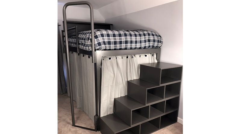 A fire pole accessory attached to a charcoal queen size Adult Loft Bed with a staircase