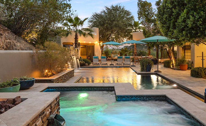 Photo of the outdoor pool and hot tub of The Happy Roadrunner property in Phoenix, Arizona.