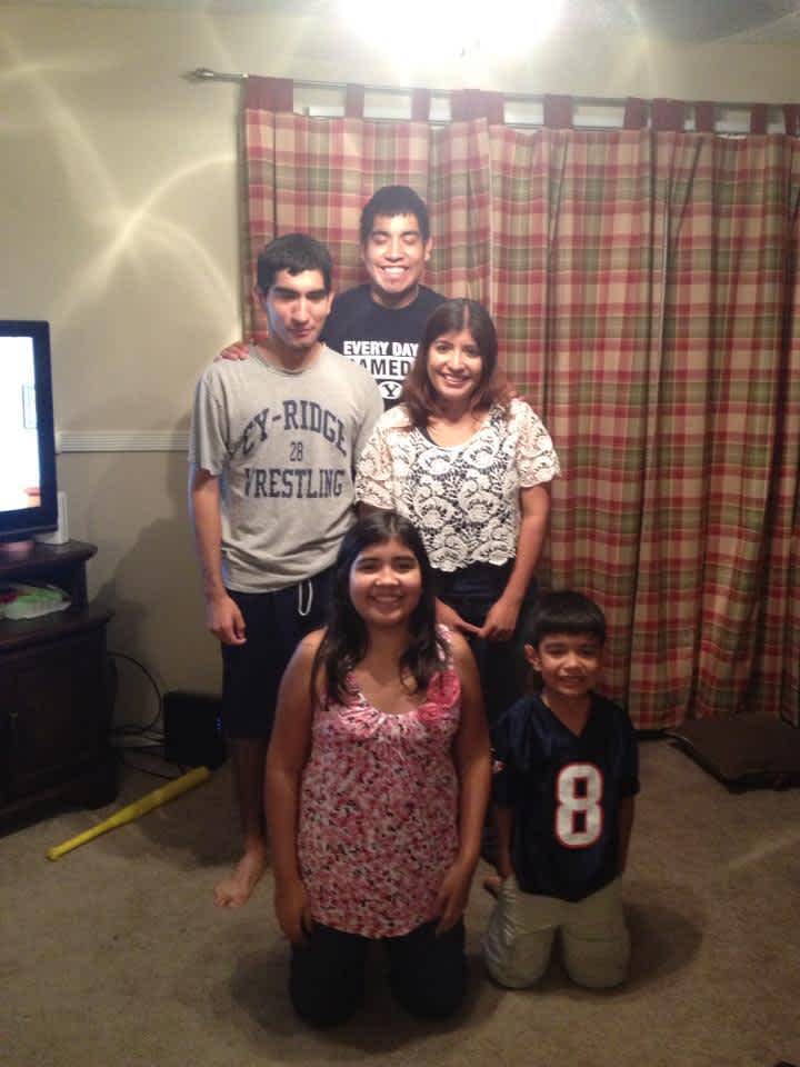 Martinez siblings kneeling