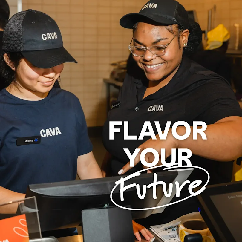 Two CAVA team members work at the cash register. Text on the image says, "Flavor Your Future"