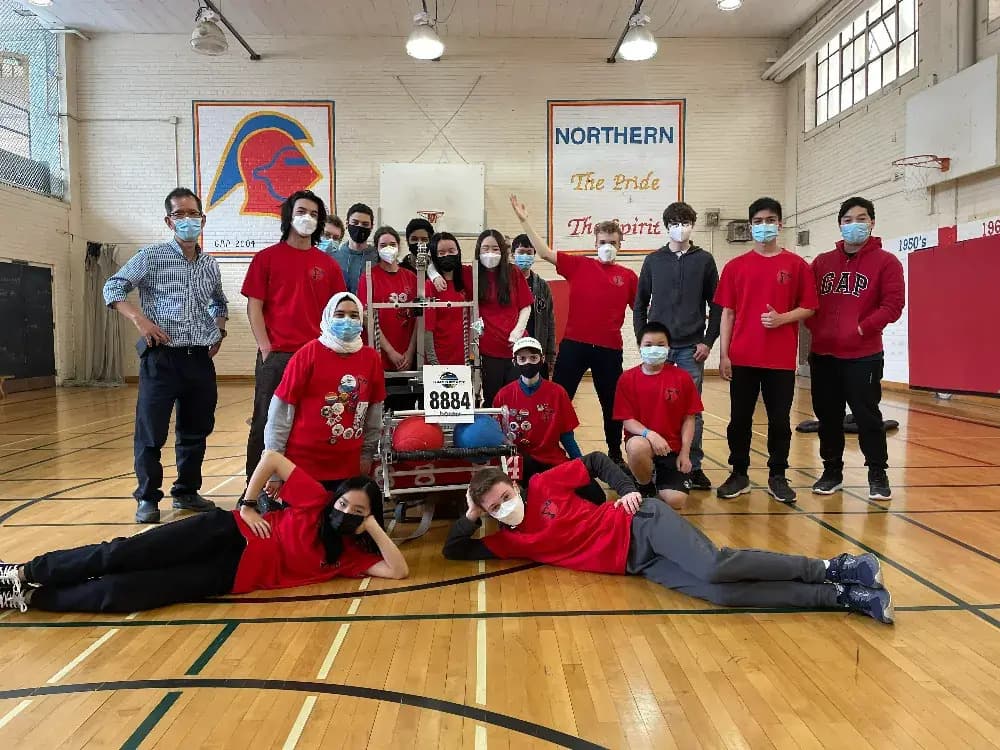 The 2022 robotics team with our 2022 robot Sharpie in the gym
