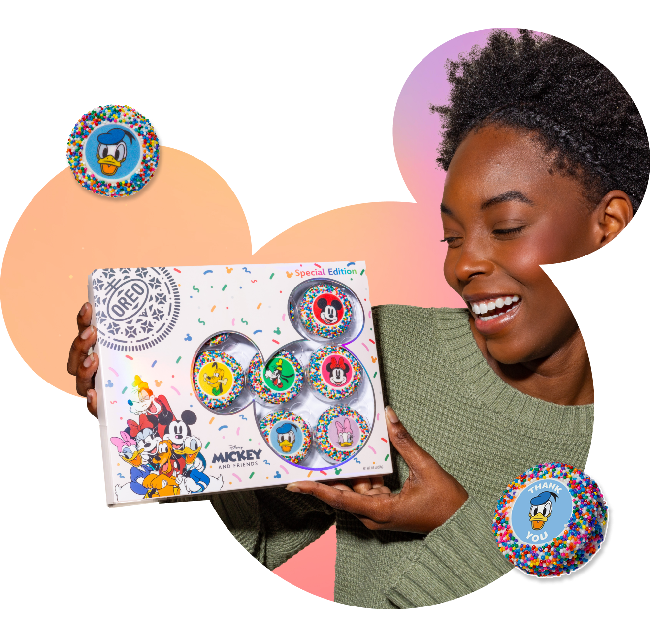 Woman holding a box of Mickey & Friends OREOiD Cookies