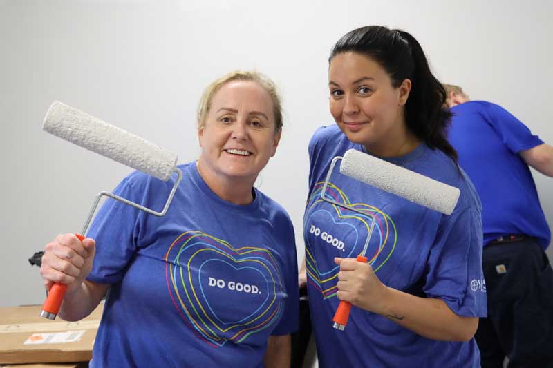 A photo of two VyStar employees at a volunteer event