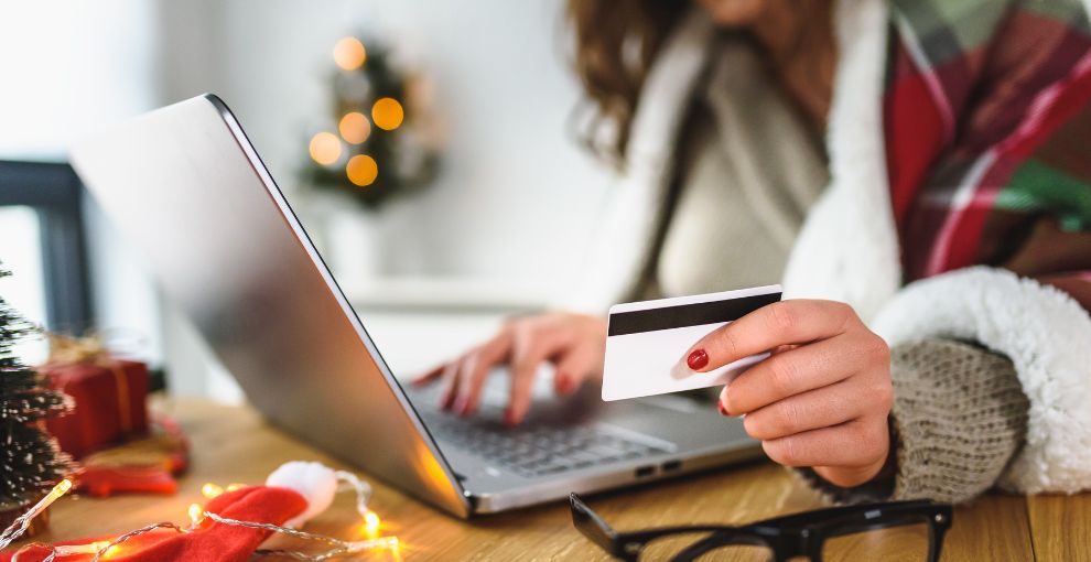 Woman on laptop with credit card