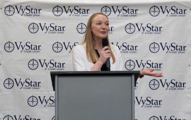 VyStar Product Marketing Specialist Megan Brink delivers the keynote speech at a High School Debit Card Give Back Program ceremony.