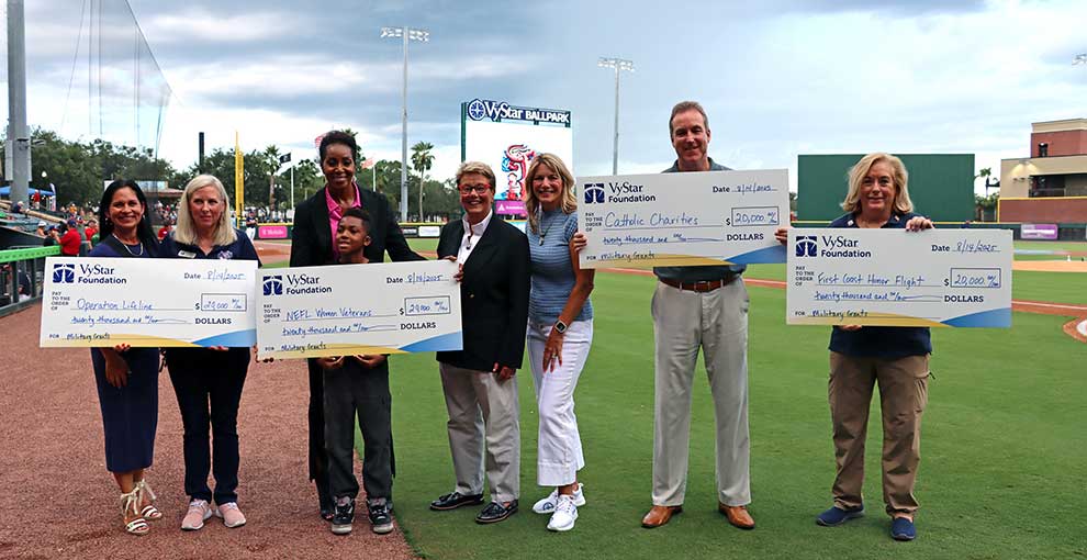 Grant recipients from the Northeast Florida region Military grant cycle from the VyStar Foundation at the VyStar Ballpark in Jacksonville