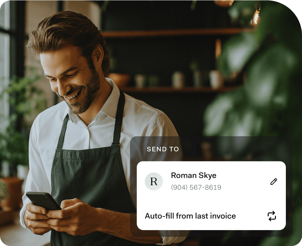 Smiling business owner in an apron using a smartphone, with an on-screen overlay showing an invoice being auto-filled for a repeat customer named Roman Skye.