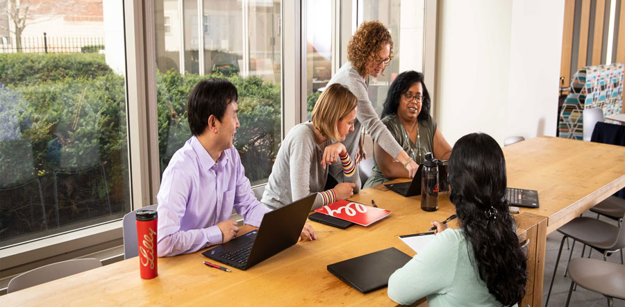 vertical-card-group-of-people-working-together-in-front-of-window-19017-0201.jpg