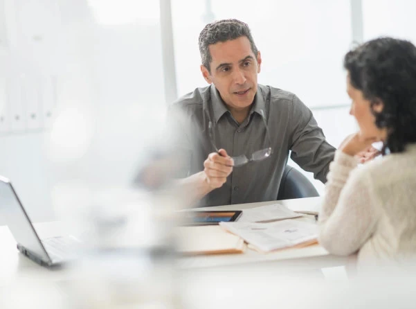 man speaking to woman