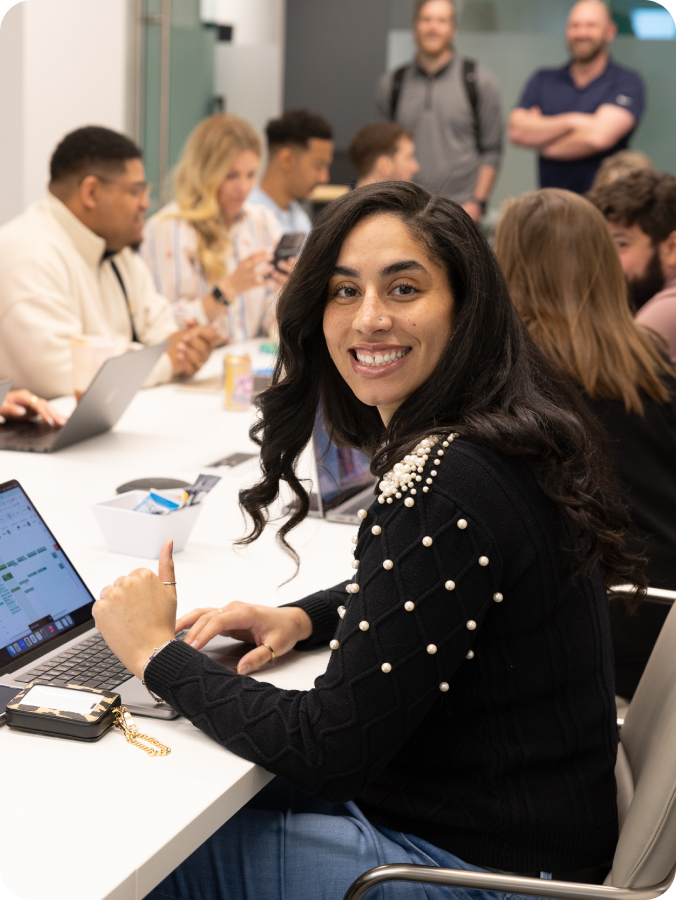 Greenlight employee smiling in conference room