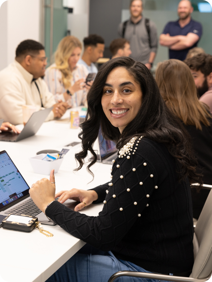 Greenlight employee smiling in conference room