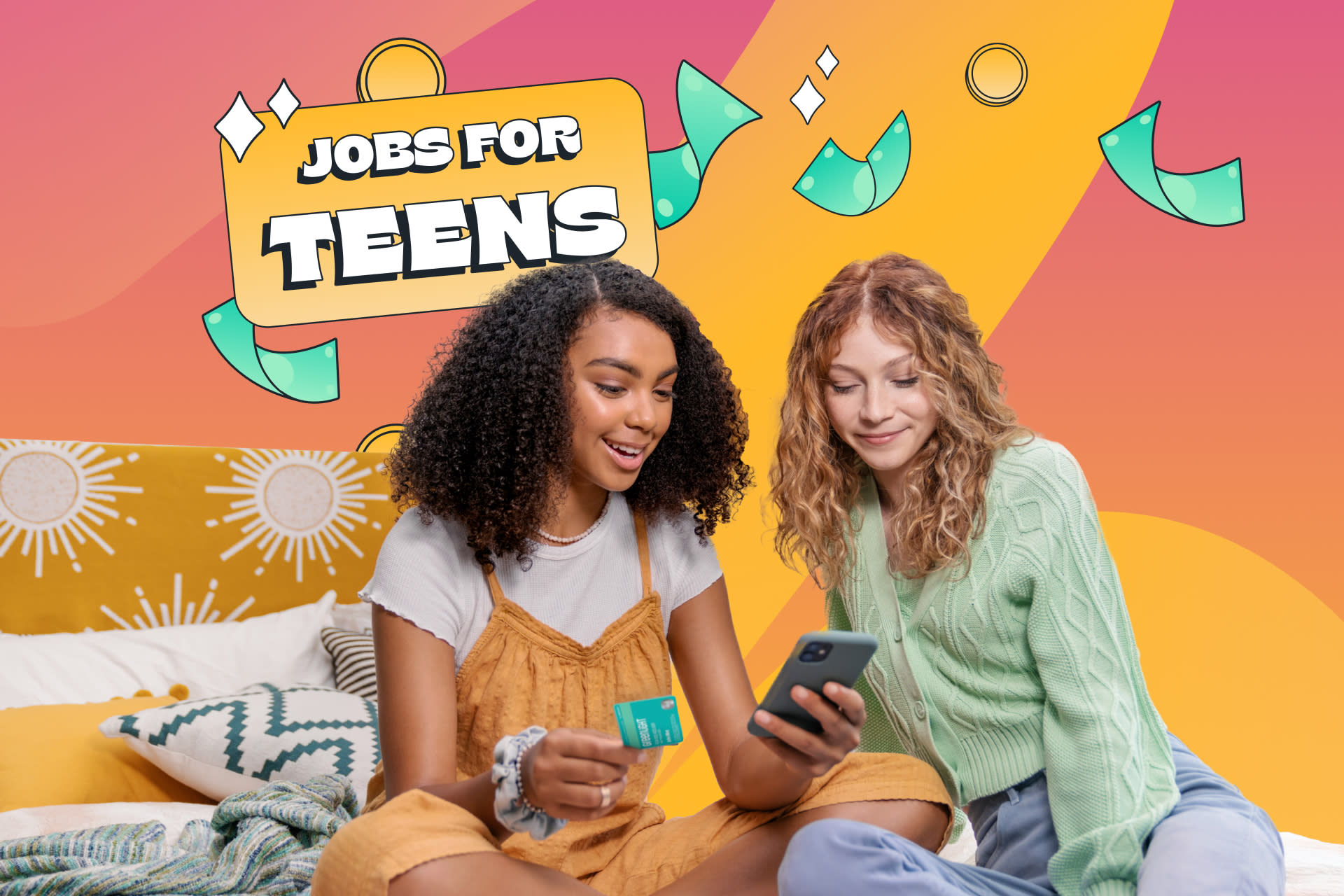 Two teenage girls sitting and researching jobs for teens using Greenlight teen money app on mobile