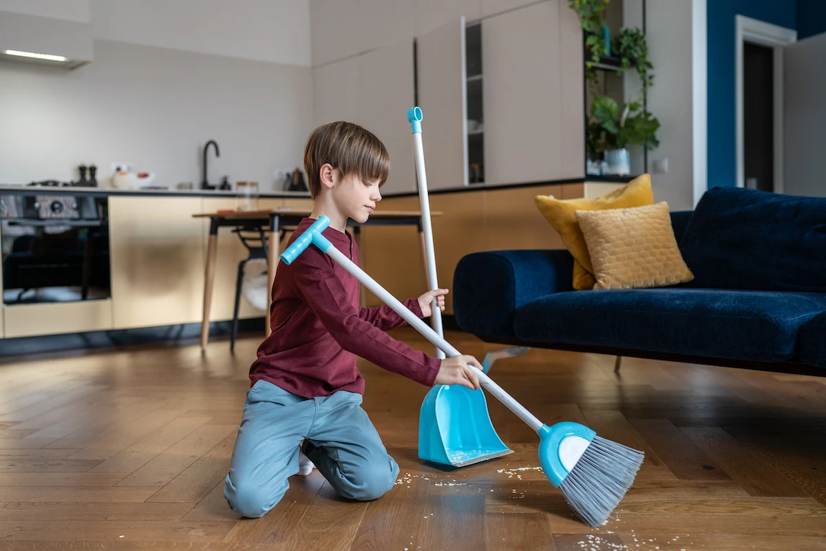 Jobs for 13 year olds: teenager sweeping the floor