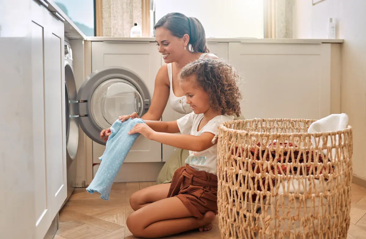 Mother and daughter doing the laundry