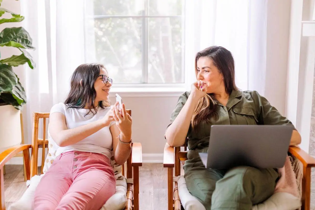 How does depreciation work: woman showing her phone to her friend