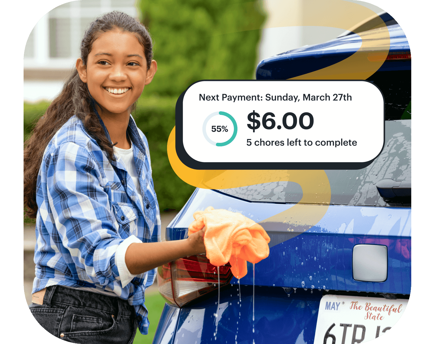 teen girl washing a car with a greenlight chore payment notification near her