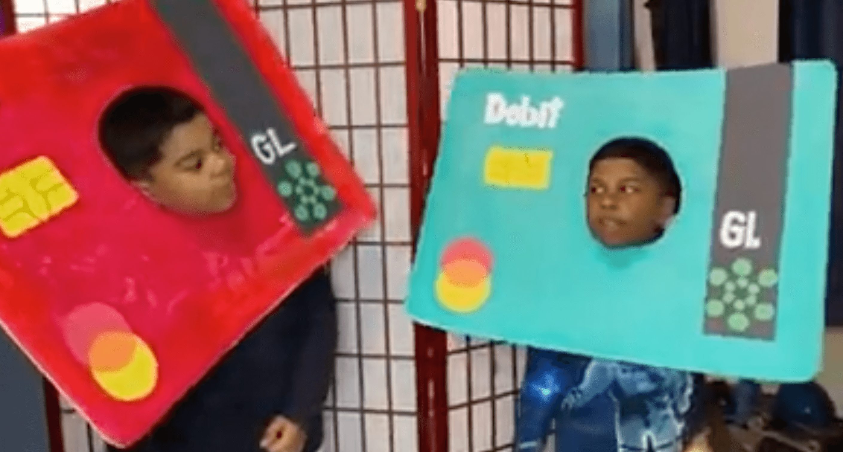 boys dressed up as greenlight debit cards