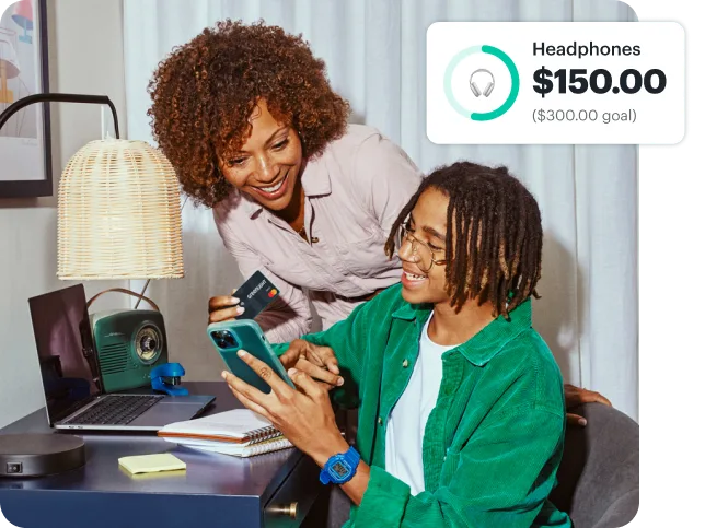 GL126 Day02 04E LivingRoom DadTeachingSonToUseApp 07761 1