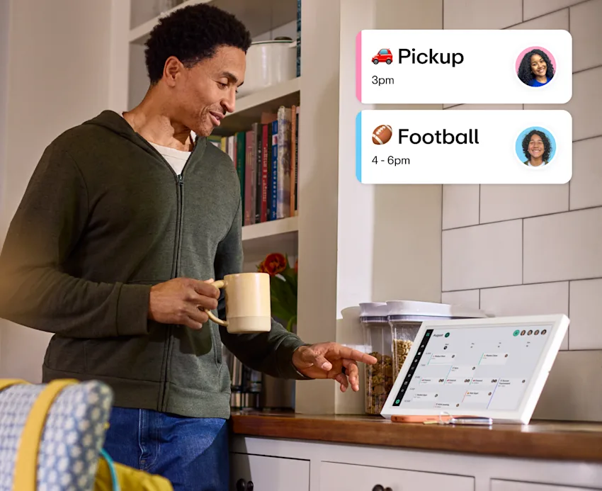 man looking at family hub calendar