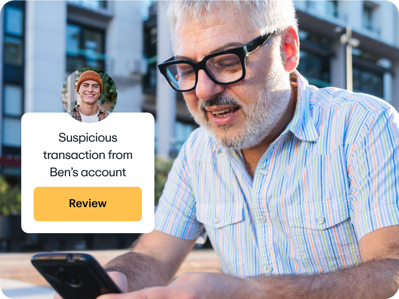 Father receiving a notification about a suspicious transaction from his son's account