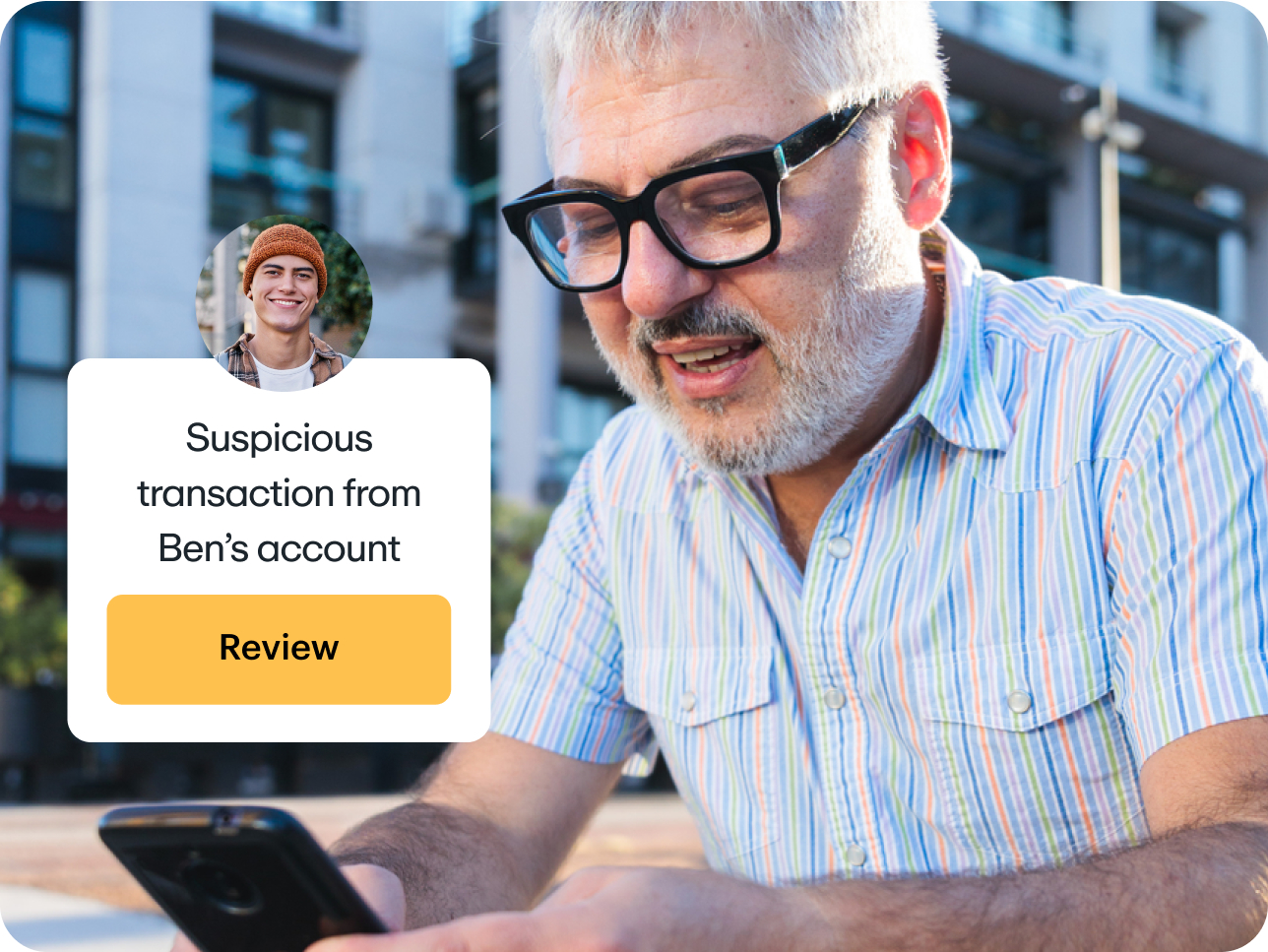 Father receiving a notification about a suspicious transaction from his son's account