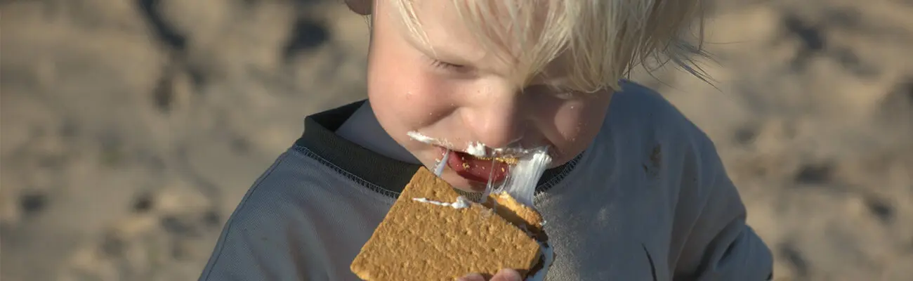 kid eating a smore