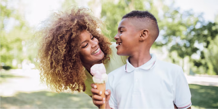 mom with her son holding an ice cream cone