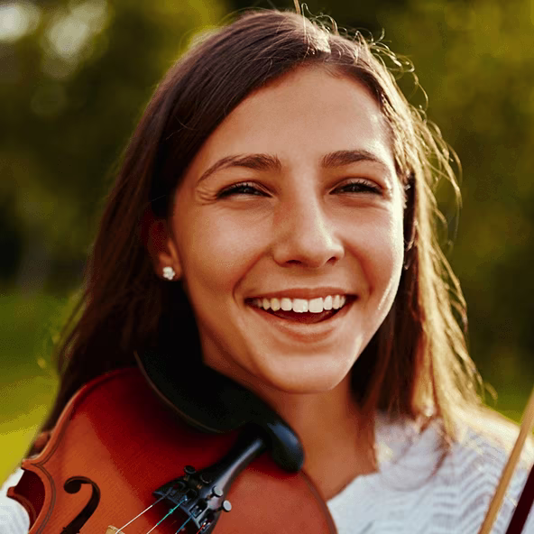 girl holding her violin