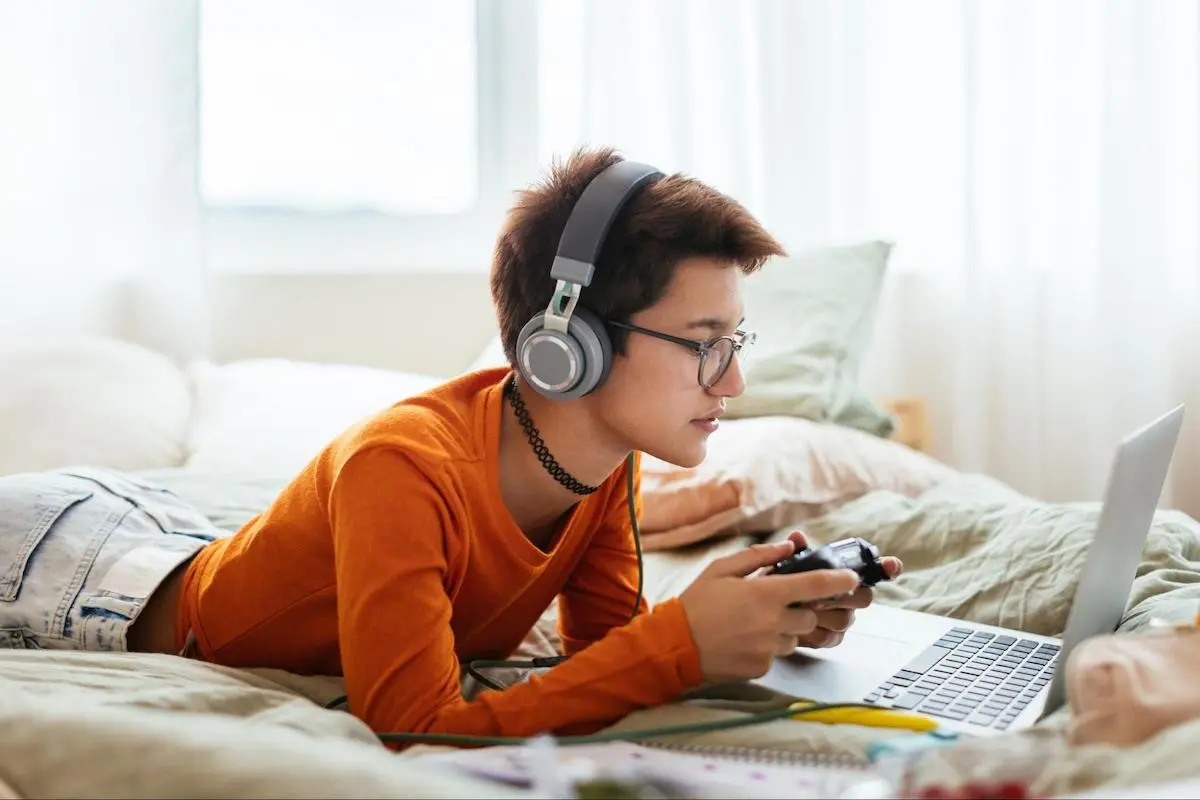 Teenager playing video games