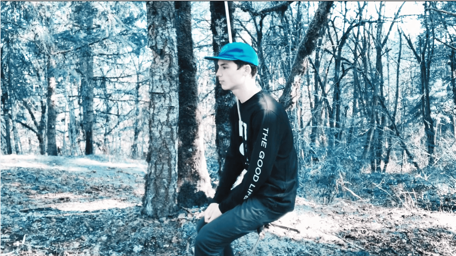 teen boy in the woods