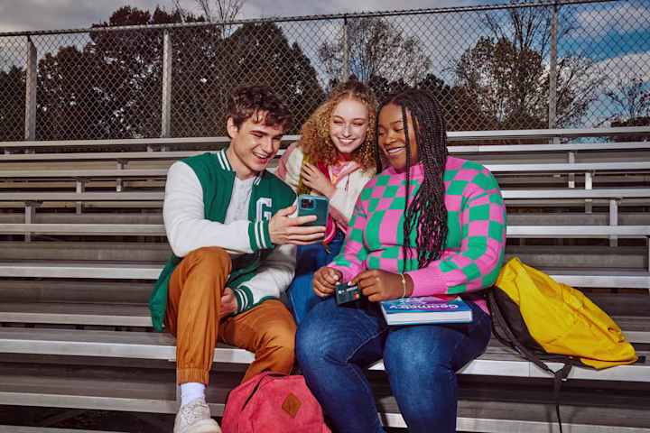 Group of teens sitting on school bleachers