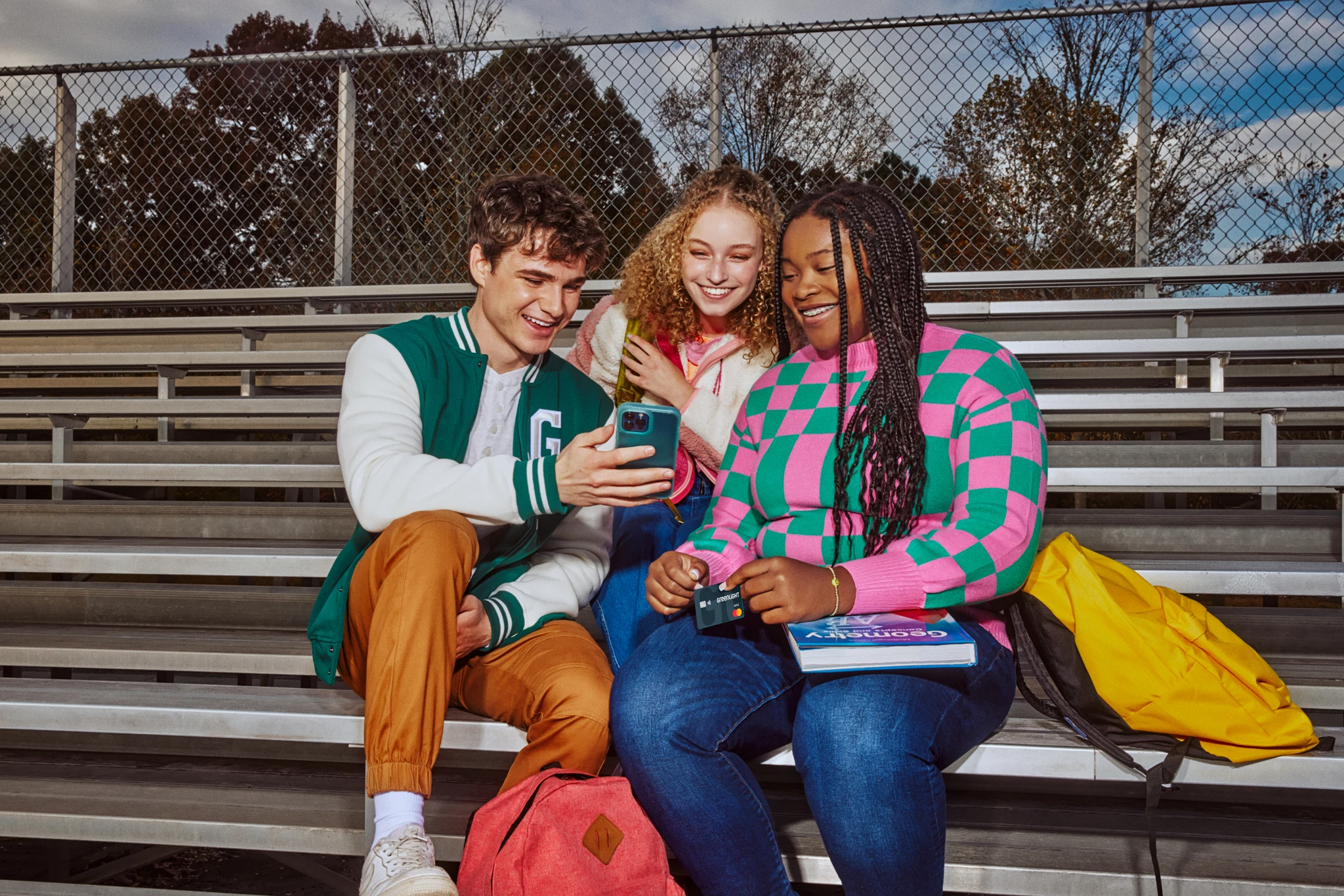 Group of teens sitting on school bleachers