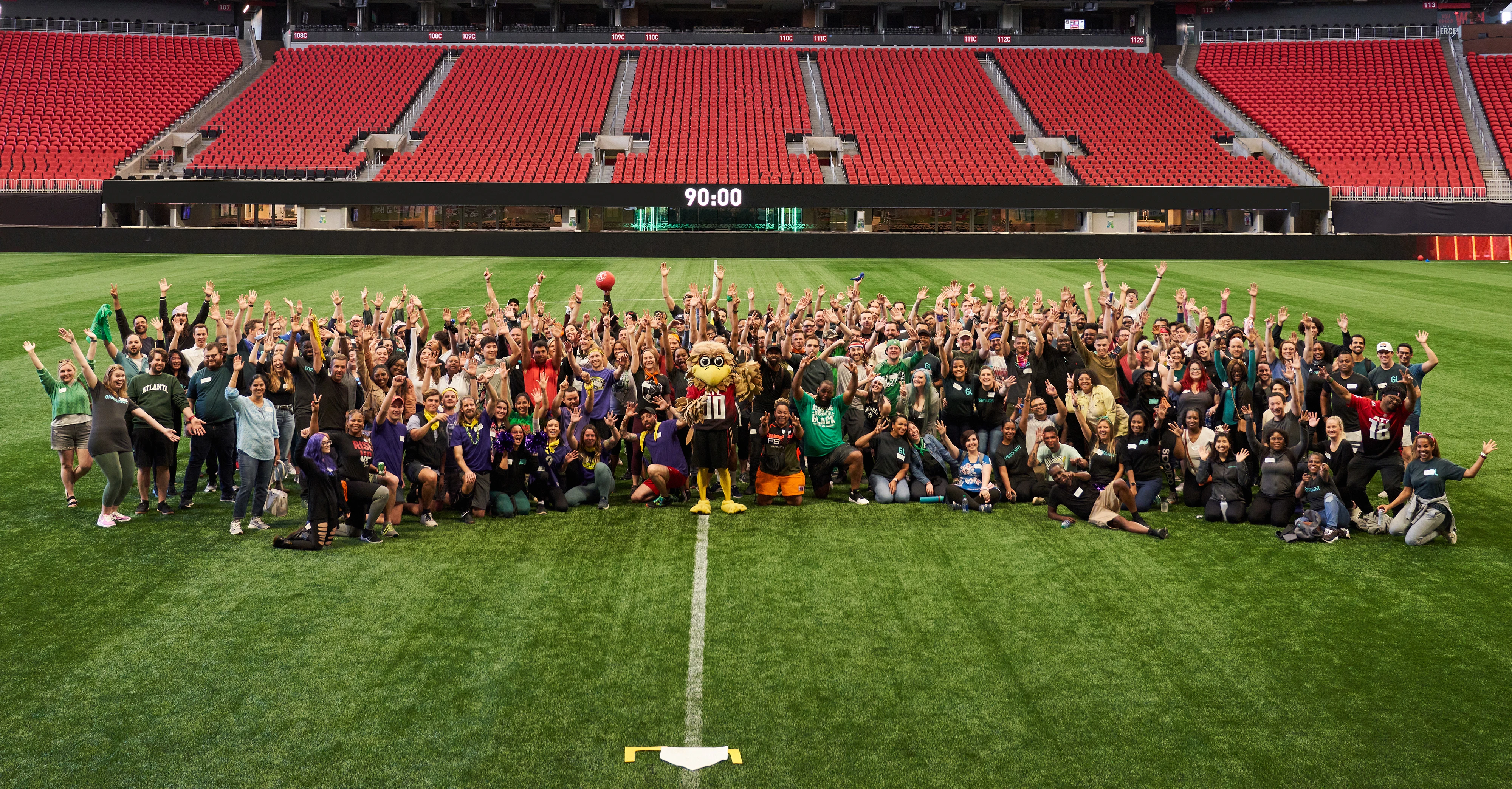 Company picture at kickball event in Atlanta stadium