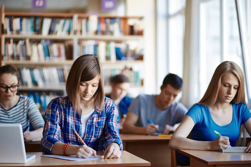 Does 529 affect financial aid: students writing on their notebooks