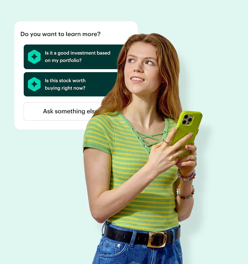 Person in green striped top holding phone with investment questions interface showing portfolio and stock inquiries.