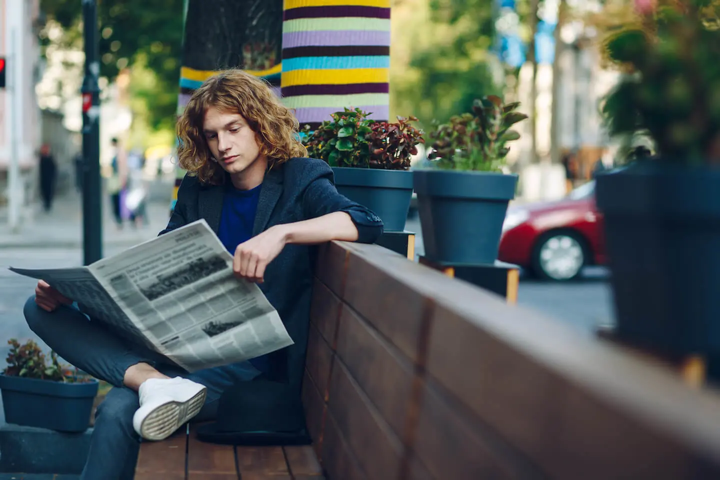 What happens in a recession: man reading a newspaper