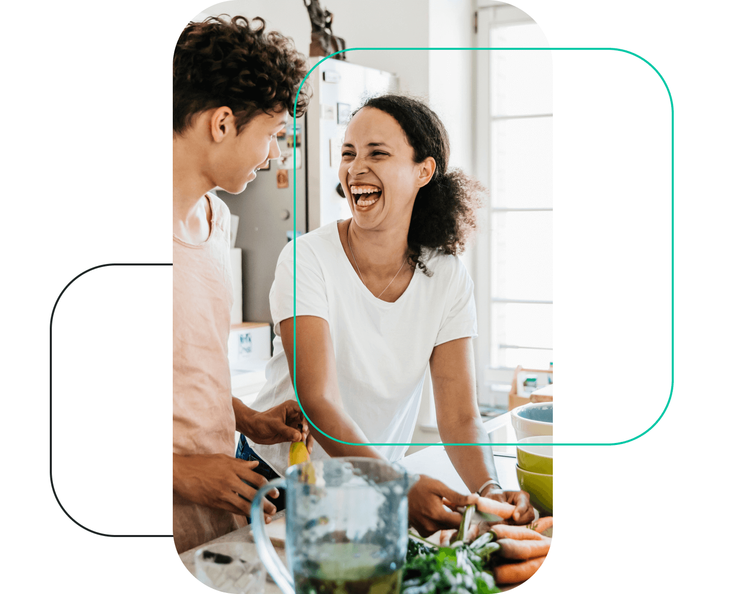 Smiling mom and teen son in kitchen cooking and talking about Greenlight’s family credit card with up to 3 percent cash back
