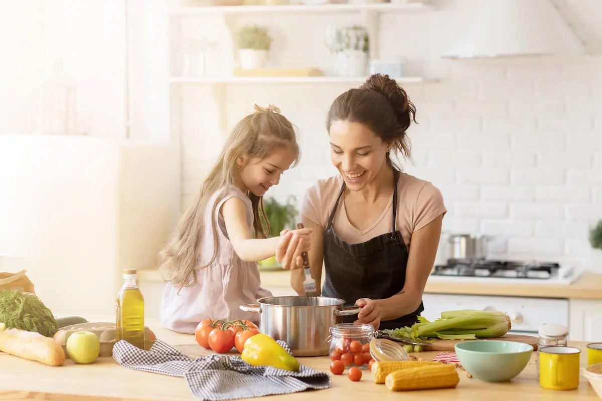 Mother and daughter preparing their food