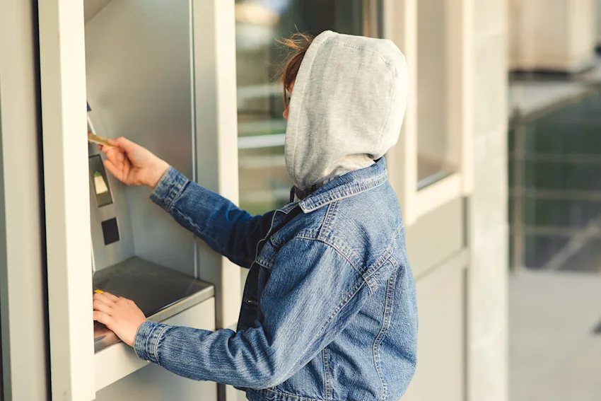 Person withdrawing from an ATM.