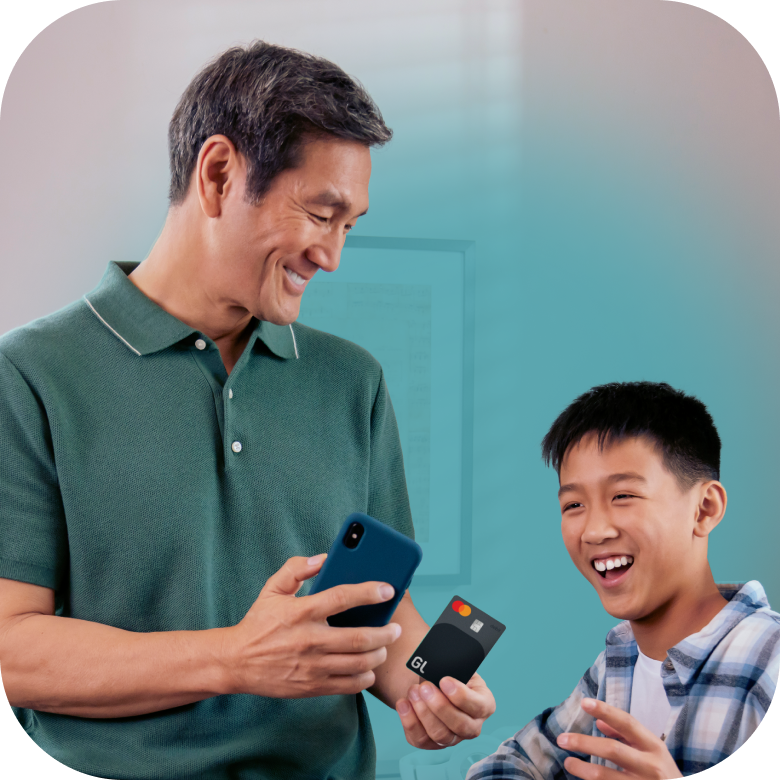 Father and Son Using Greenlight Debit Card and Greenlight App