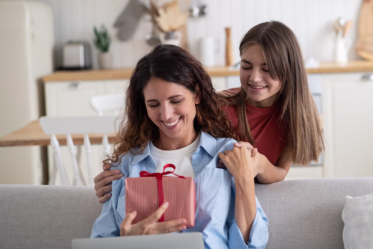 Daughter giving a gift to her mother