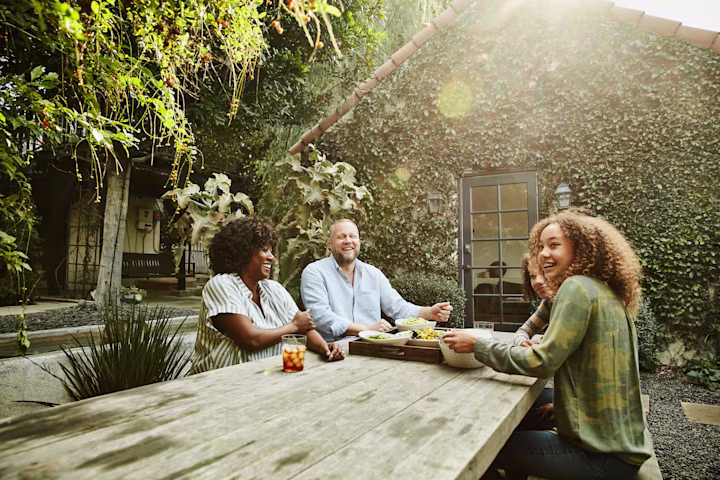 parents at a table with their daughters
