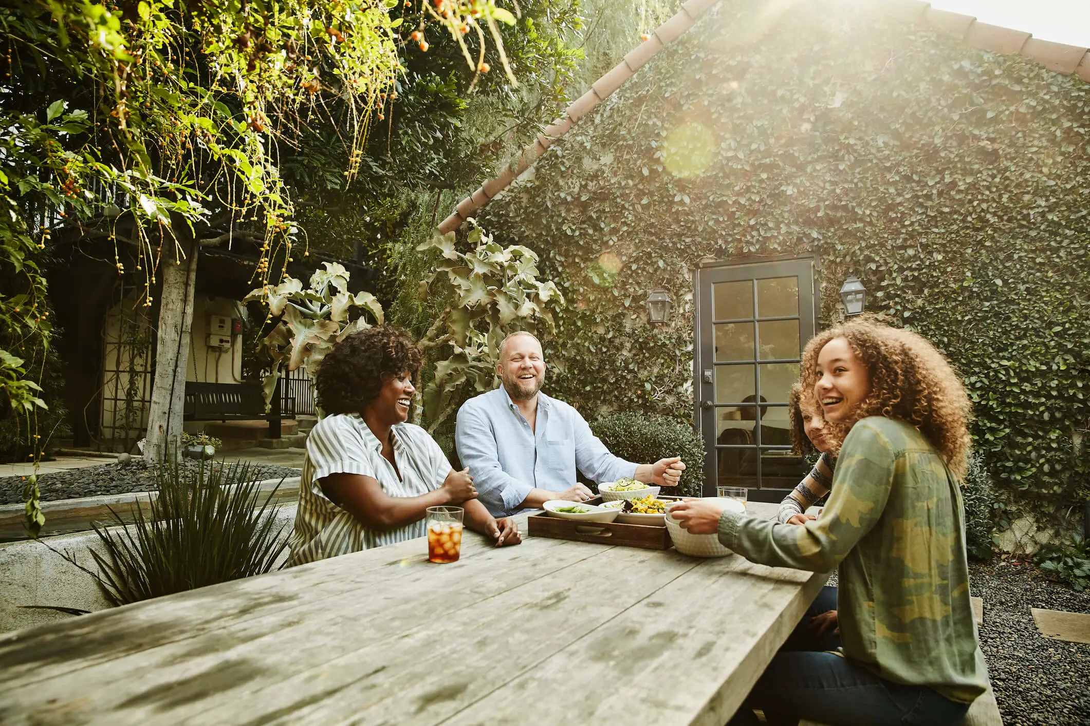 parents at a table with their daughters